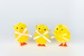 Funny looking Easter chicken toys on grey background