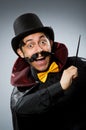 Funny magician man with wand and hat Royalty Free Stock Photo