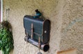Funny mailbox looks like school bag on house wall at Hallstatt