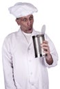 Funny Male Cook or Chef Looking in Food Tin Can Royalty Free Stock Photo