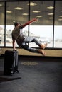 Funny man in airport with suitcase Royalty Free Stock Photo