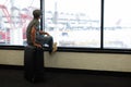 Funny man in airport with suitcase Royalty Free Stock Photo