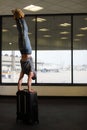 Funny man in airport with suitcase Royalty Free Stock Photo