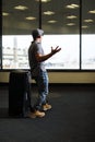 Funny man in airport with suitcase Royalty Free Stock Photo