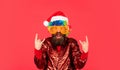 Funny man with beard. Christmas spirit. Cheerful clown colorful hairstyle. Winter holidays. Sorry Santa, Naughty just