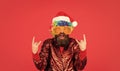Funny man with beard. Christmas spirit. Cheerful clown colorful hairstyle. Winter holidays. Sorry Santa, Naughty just