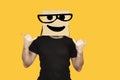 Funny man with box on his head and emoji having fun. Crazy rock and roll party and celebration