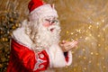 Funny man dressed as santa claus with big white beard on decorated background Royalty Free Stock Photo