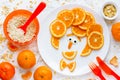 Funny man face fruit plate - creative idea for healthy snack or dessert for kids