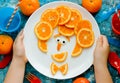 Funny man face fruit plate - creative idea for healthy snack or dessert for kids