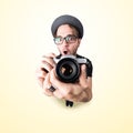 Funny man with a funny surprise expression shooting with his vintage reflex photo camera Royalty Free Stock Photo