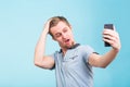 Funny man grimacing while making selfie Royalty Free Stock Photo