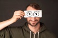 Funny man looking with hand drawn paper eyes Royalty Free Stock Photo