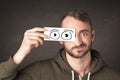 Funny man looking with hand drawn paper eyes Royalty Free Stock Photo