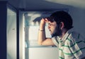 Funny man looking into refrigerator Royalty Free Stock Photo
