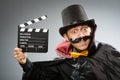 Funny man with movie clapboard