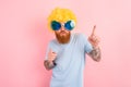 Funny man with peruke and sunglasses dances Royalty Free Stock Photo