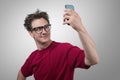 Funny man photographing himself on a smartphone