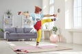 Funny Man In Retro Sportswear And Amusing Horse Mask Exercising At Home Royalty Free Stock Photo