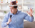 The funny man singing songs in karaoke at home Royalty Free Stock Photo