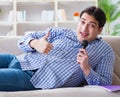 Funny man singing songs in karaoke at home Royalty Free Stock Photo