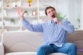 The funny man singing songs in karaoke at home Royalty Free Stock Photo