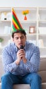 Funny man singing songs in karaoke at home Royalty Free Stock Photo