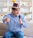 Funny man singing songs in karaoke at home Royalty Free Stock Photo