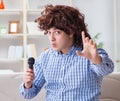 Funny man singing songs in karaoke at home Royalty Free Stock Photo