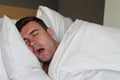 Funny man snoring in bed