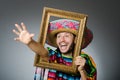 The funny man with sombrero and picture frame Royalty Free Stock Photo