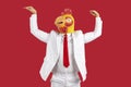 Funny man in chicken mask dance in studio