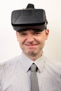 An funny man wearing Oculus Rift VR virtual reality headset, fooling around