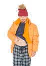 Funny man wearing red hat and yellow down jacket scratching his belly