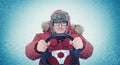 Funny man in winter clothes with steering wheel, snow blizzard. Concept car driver Royalty Free Stock Photo