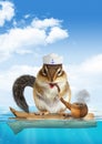 Funny mariner concept, animal chipmunk floating ocean Royalty Free Stock Photo