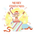 Funny Merry Christmas card with monkey jumping out of present bo Royalty Free Stock Photo