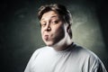 Funny middle aged acting ape man over gray Royalty Free Stock Photo