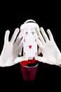 Funny mime holding a ace of hearts Royalty Free Stock Photo