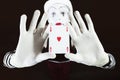 Funny mime holding a ace of hearts