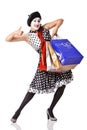 Funny mime in spotty dress holding shopping bags