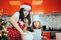 Mother and Daughter Kneading Dough Cooking Together for Christmas Royalty Free Stock Photo