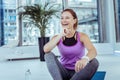 Cheerful mature woman having fun during training