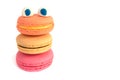A funny monster with eyes made of macarons