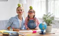 funny mother and child daughter doing homework writing and reading Royalty Free Stock Photo