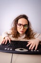 Funny nerd girl working on computer Royalty Free Stock Photo