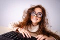 Funny nerd girl working on computer Royalty Free Stock Photo