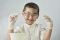 Funny nerd kid in glasses the world of chemistry