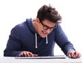 Funny nerd man working on computer isolated on white Royalty Free Stock Photo