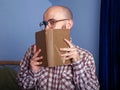 Funny nerd reading a book